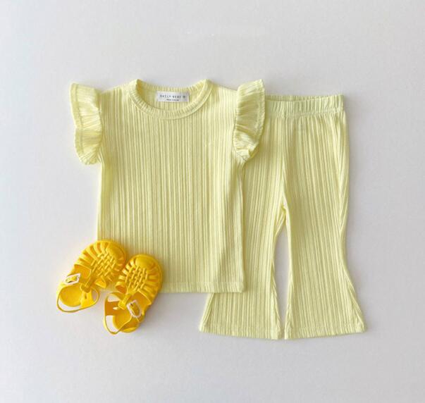 Girl yellow T-shirt bell bottom pants outfits